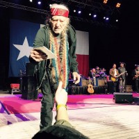 Willie Nelson accepts Bella Collins' CD Willie gets Bella's CD.jpg